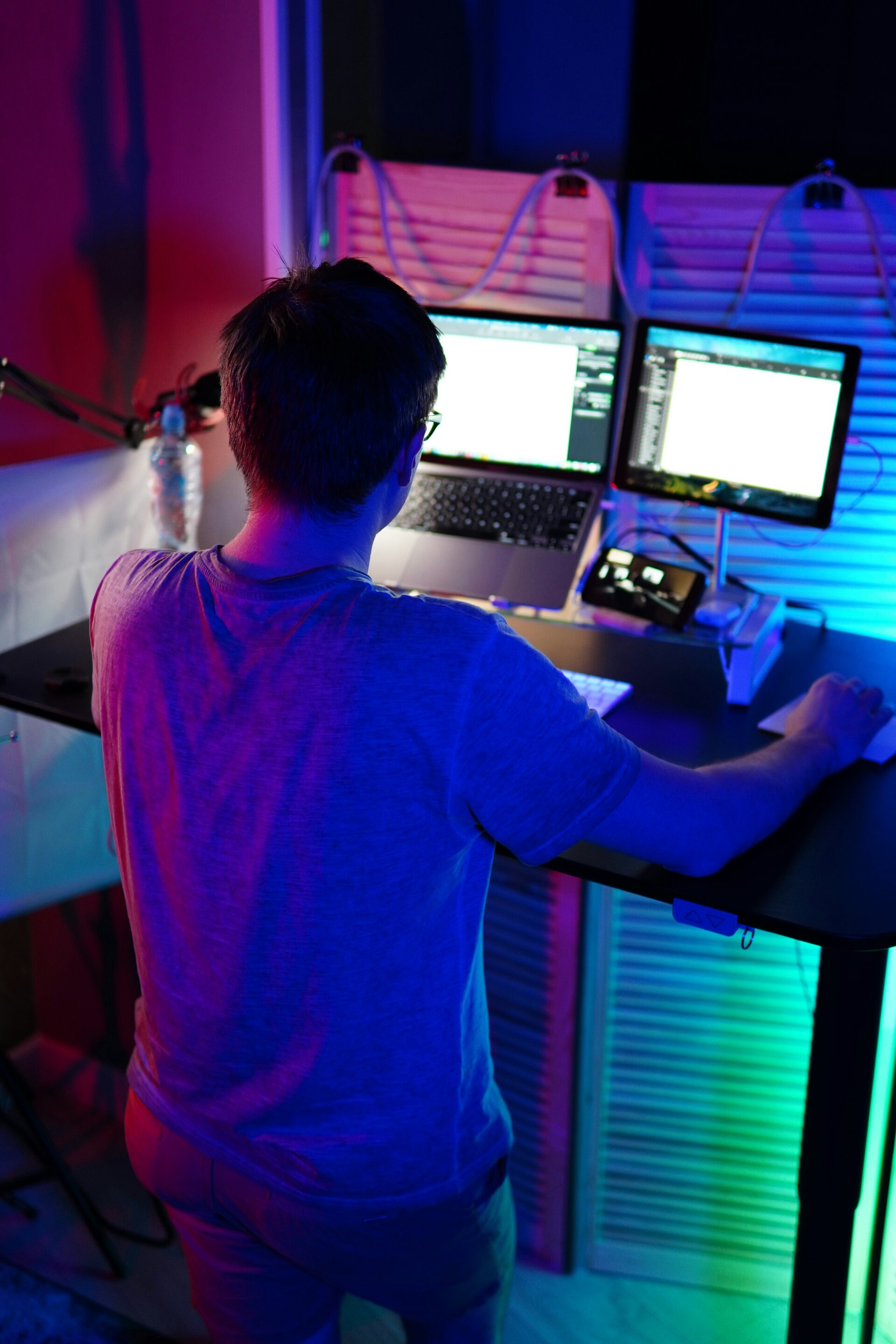 Engineer at a workstation in a technical room